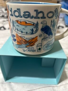 Starbucks Idaho Ceramic Mug in White with Blue and Orange Illustrations